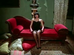 A concealed camera captures a gorgeous wife masturbating on a couch.